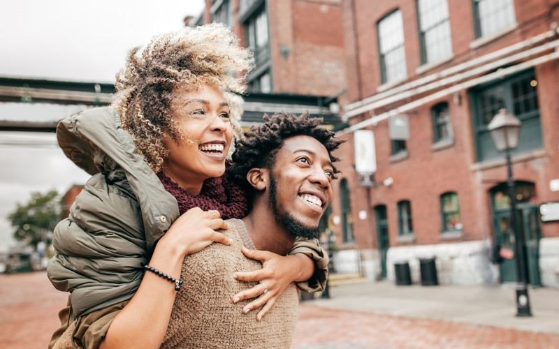 a couple walking in a downtown area